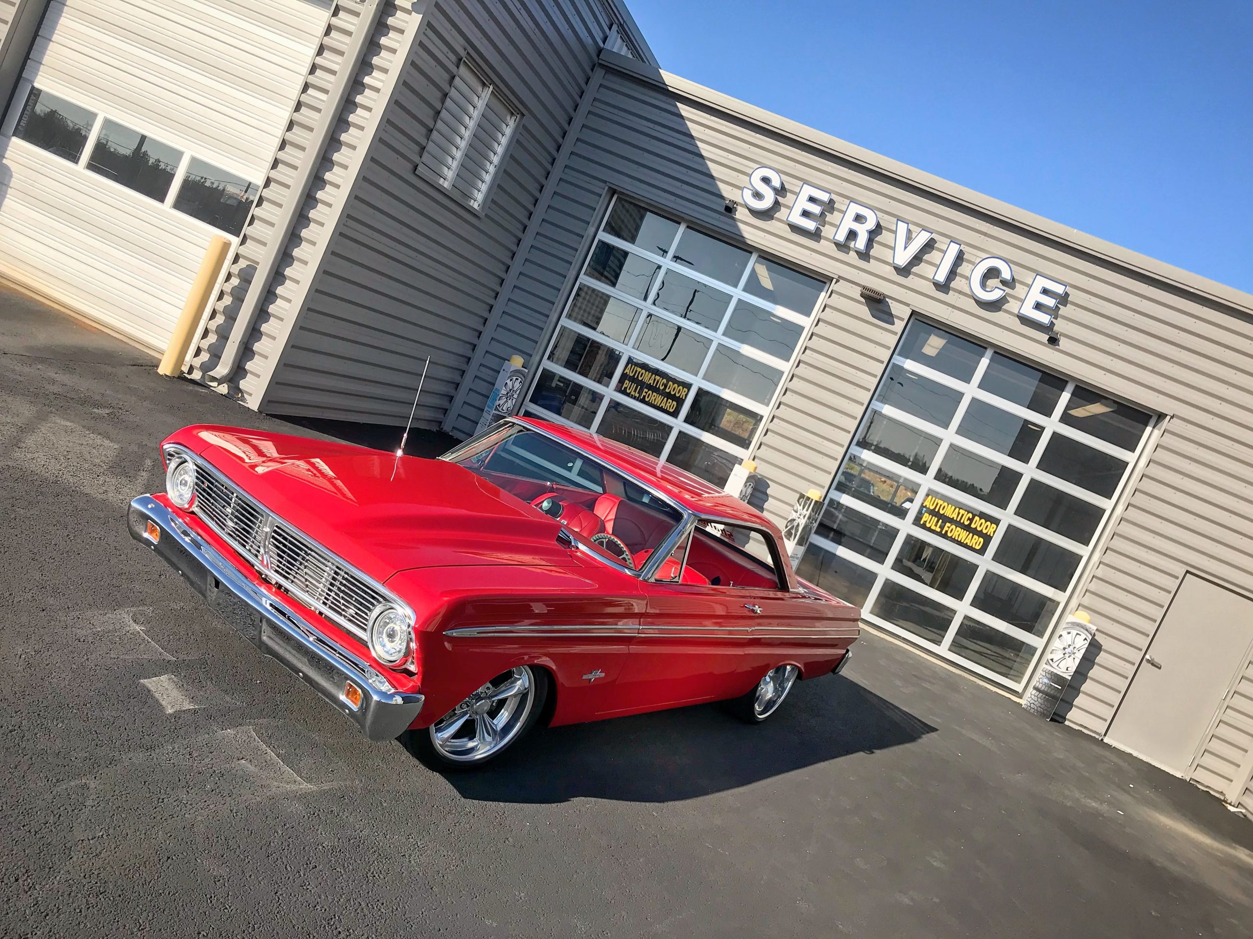 Falcon in front of service bay