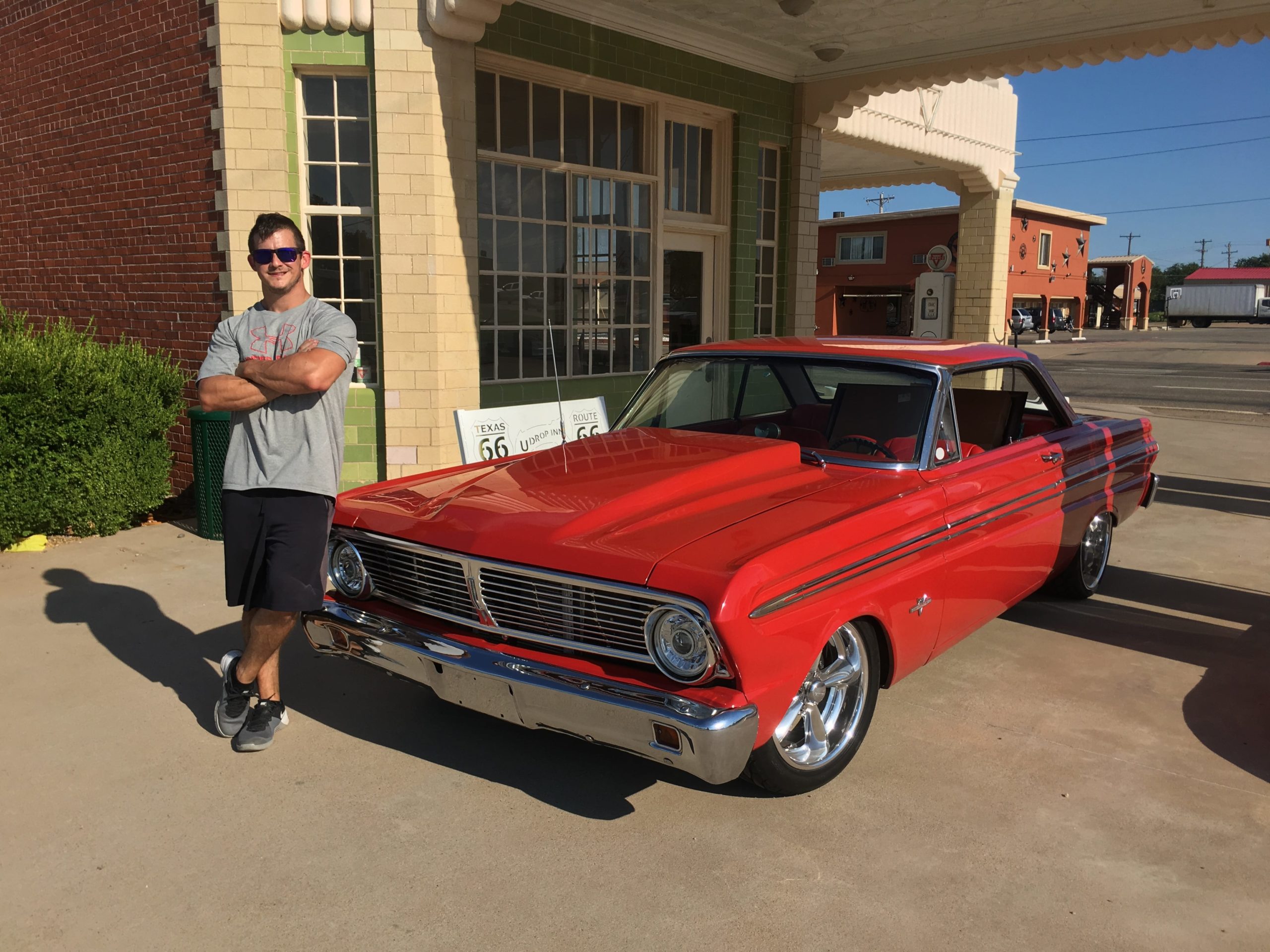 Man standing next to Falcon